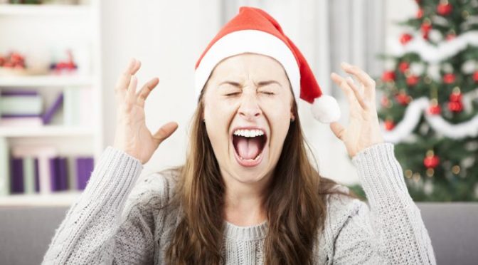 Stressed Woman wearing Christmas Hat