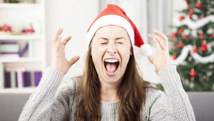 Stressed Woman wearing Christmas Hat