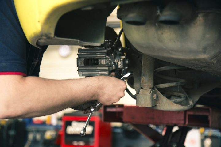 Mechanic working on car