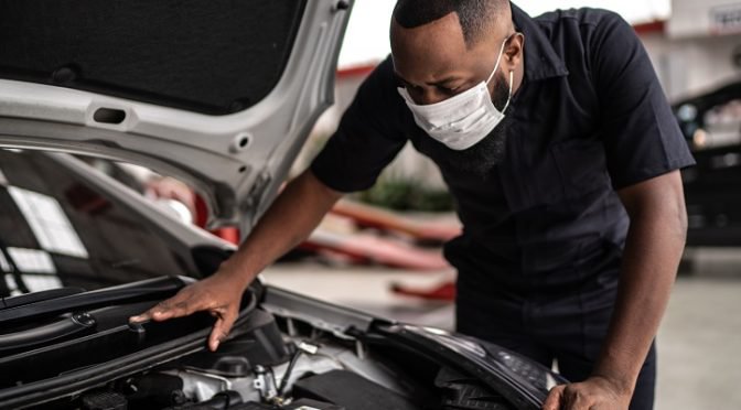 Auto mechanic man with face mask