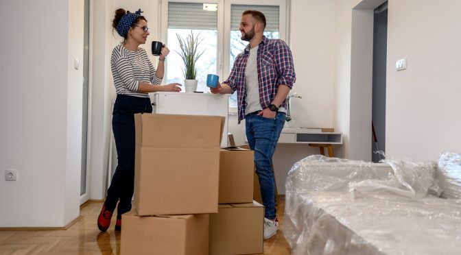 young couple moving in house